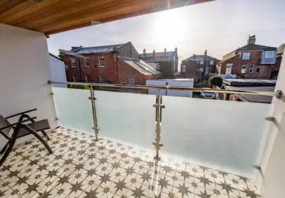 a balcony with a view of a building at Olive Lodge Lytham in Lytham St Annes