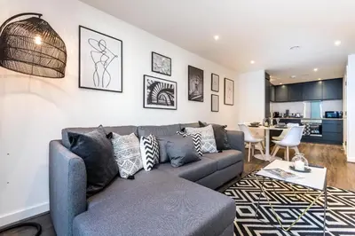 a living room with a couch and a table at Chavasse Cove Sleeping 6 Guests With Parking in Liverpool