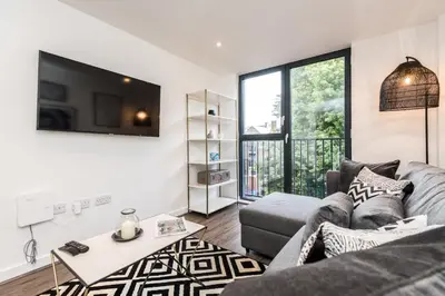 a living room with a couch and a tv at Chavasse Cove Sleeping 6 Guests With Parking in Liverpool
