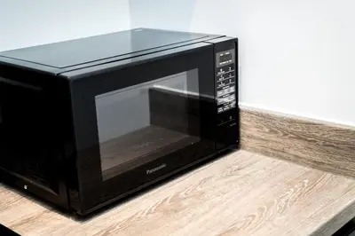 a microwave oven sitting on top of a counter at Chavasse Cove Sleeping 6 Guests With Parking in Liverpool