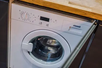 a washing machine with its door open in a room at Industrial 2BR Apt, Liverpool City Centre Sleeps 8 in Liverpool