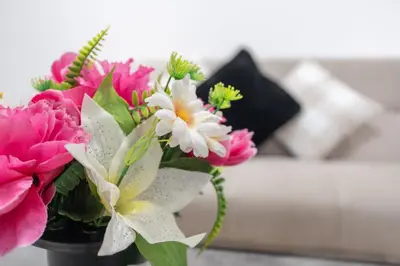 a vase filled with pink and white flowers at Ideal Work Trips Washer SofaBed Free Parking in Liverpool