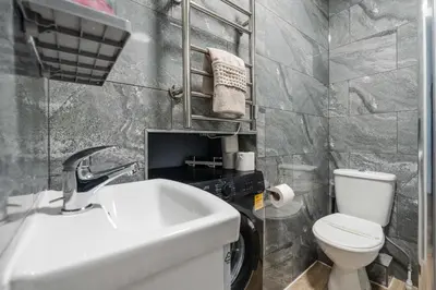 a bathroom with a sink and a toilet at TopFloor Apt LikeHome Long-Term Free Parking in Liverpool