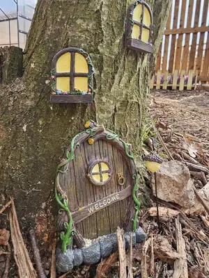 a tree with three windows on the side of it at The Garden in Hambleton
