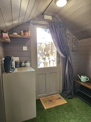 a small room with a door and a window at The Garden in Hambleton
