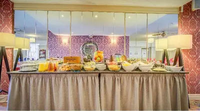 a buffet of food on top of a table at Adelaide House Hotel - Opposite Winter Gardens, Town Centre in Blackpool