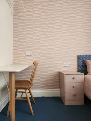 a desk and a chair in a bedroom at The Everglades in Blackpool