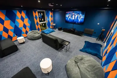 a room with couches and a flat screen tv at URBAN HUB Student Accommodation in Preston
