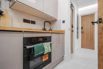 a kitchen with a stove and a sink at Work Desk Shared Kitchen Budget Parking in Liverpool