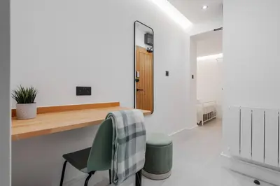a kitchen with a desk and a green chair at Work Desk Shared Kitchen Budget Parking in Liverpool