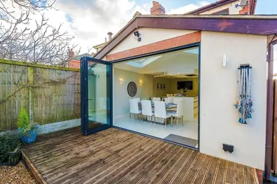 an extension to a house with sliding glass doors at 4 Bed House Relocators Trades and long stays in Samlesbury