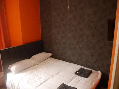 a bed with two pillows on it in a room at The Stone House Hotel in Blackpool