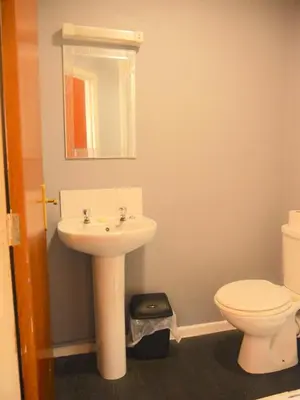 a bathroom with a sink and a toilet at The Stone House Hotel in Blackpool