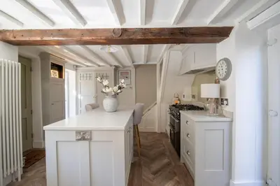 a kitchen with white cabinets and a white ceiling at Rainbow Cottage Spacious Detached Home, Hot Tub, Sleeps 7 in Ormskirk