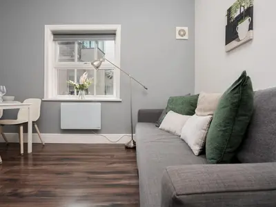 a living room with a couch and a table and a window at Flat 3, Colquitt St, 1 Bed, L1 - Pass the Keys in Liverpool
