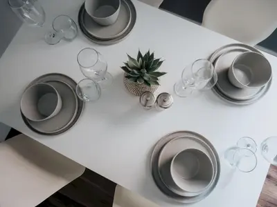 a white table with wine glasses and a plant on it at Flat 3, Colquitt St, 1 Bed, L1 - Pass the Keys in Liverpool