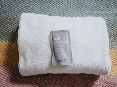 a tube of hair and body cream sitting on a towel at Flat 1, Colquitt St, 1 Bed, L1 - Pass the Keys in Liverpool