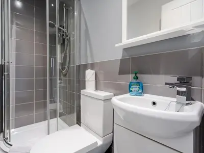 a bathroom with a toilet and a sink and a shower at Flat 1, Colquitt St, 1 Bed, L1 - Pass the Keys in Liverpool
