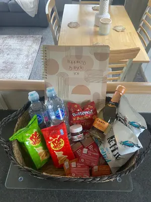 a basket full of food and drinks and a box at Seaside Retreat-Sleeps 8-Free Parking in Morecambe