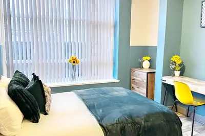 a bedroom with a bed and a window and a desk at Oak Suite - 2 Bed - Sleeps 4 - Central Blackpool in Blackpool