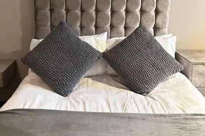 two pillows sitting on top of a bed at Oak Suite - 2 Bed - Sleeps 4 - Central Blackpool in Blackpool
