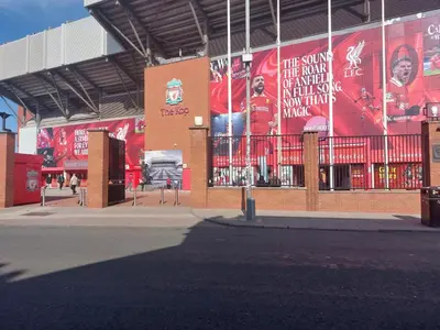 a building with posters on the side of it at Anfieldstadiumroomz in Liverpool