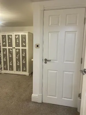 a room with a white door and a closet at Beach House Courtyard 2 bed in Southport
