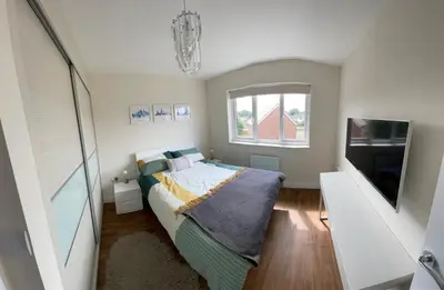 a small bedroom with a bed and a television at Small Double Room in Lancaster Riverside - 15 Minutes Walk to City Centre in Torrisholme