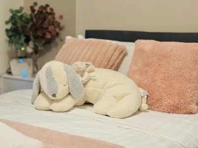 two stuffed animals are sitting on a bed at Room 1 Shared House in Bootle in Litherland