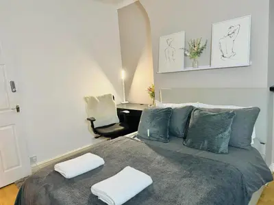 a bedroom with a bed with two towels on it at Room 3 Shared House in Bootle in Litherland