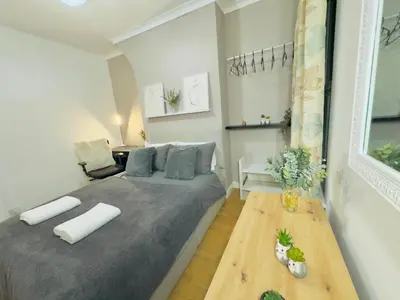 a bedroom with a large bed in a room at Room 3 Shared House in Bootle in Litherland
