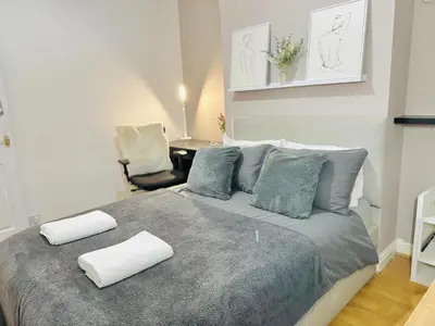 a bedroom with a bed with two pillows on it at Room 3 Shared House in Bootle in Litherland