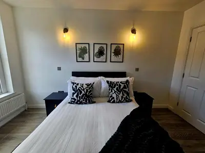 a bedroom with a bed with two pillows on it at Falkner Square in Liverpool