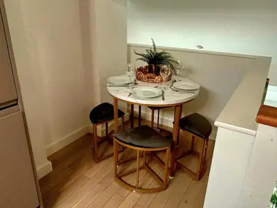 a small table with chairs and a plant on it at McCartney Place at the Cavern Quarter in Liverpool