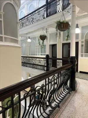 a balcony with a black railing in a building at McCartney Place at the Cavern Quarter in Liverpool