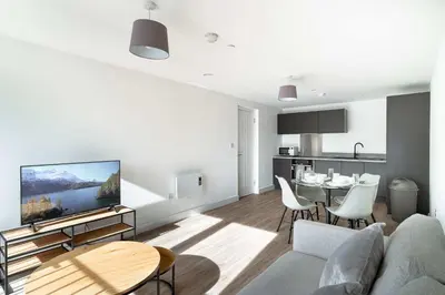 a living room with a couch and a table at Spacious & Bright 1 Bed Apartment in Liverpool in Liverpool