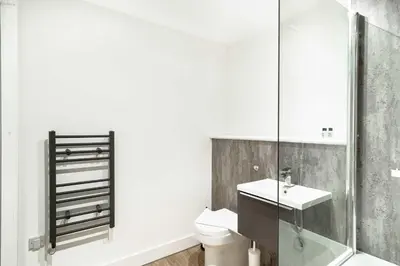 a bathroom with a toilet and a sink at Spacious & Bright 1 Bed Apartment in Liverpool in Liverpool