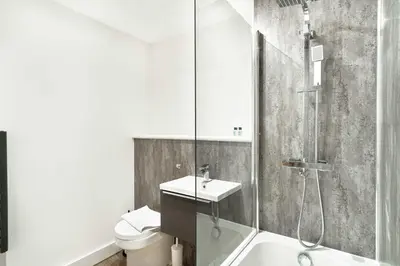 a bathroom with a shower and a sink and a toilet at Spacious & Bright 1 Bed Apartment in Liverpool in Liverpool