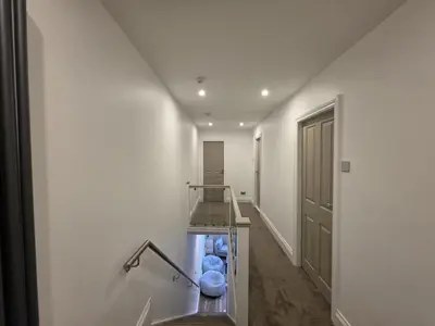 a hallway with a staircase with blue balls at #18 Anfield 5 min walk Sleeps 7 4BR 5Bed 3Bathrms in Liverpool