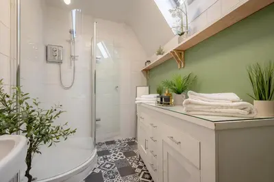 a bathroom with a sink toilet and a shower at Southport Rabbit Retreat in Southport