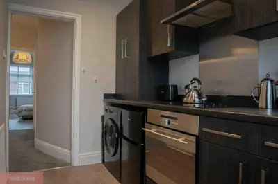 a kitchen with a sink and a stove top oven at Apartment near Blackpool Central & Pleasure Beach in Blackpool