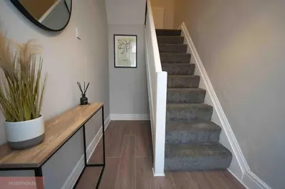 a staircase in a home with a stair case at Apartment near Blackpool Central & Pleasure Beach in Blackpool