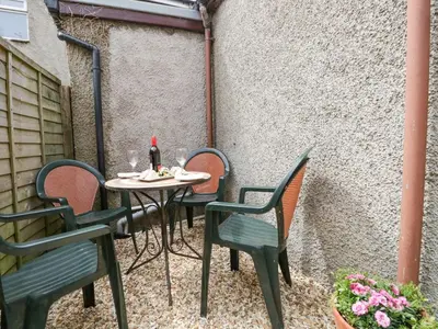 a table and chairs on a patio at The Old Surgery in Grange Over Sands