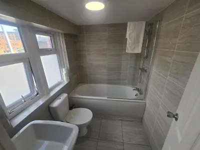 a bathroom with a tub and a toilet and a sink at Liverpool city center Apartments Dawson Street in Liverpool