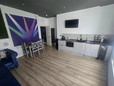 a living room with a kitchen and a dining room at Liverpool city center Apartments Dawson Street in Liverpool