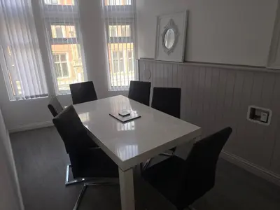 a meeting room with a white table and chairs at Liverpool city center Apartments Dawson Street in Liverpool