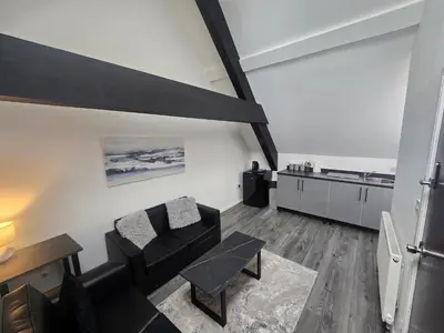 a living room with a couch and a table at Liverpool city center Apartments Dawson Street in Liverpool