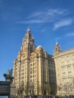 a building with a clock tower on top of it at Liverpool city center Apartments Dawson Street in Liverpool