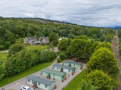 an aerial view of a village with houses and trees at Lodge 1 in Carnforth