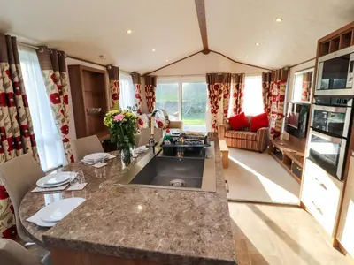 a kitchen and living room of a caravan at Lodge 4 in Carnforth
